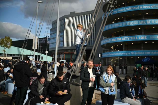 Fans arrive for the English Premier League football match between Manchester City and Ipswich Town at the Etihad Stadium in Manchester, north west England, on October 17, 2026. (Photo by Oli SCARFF / AFP)