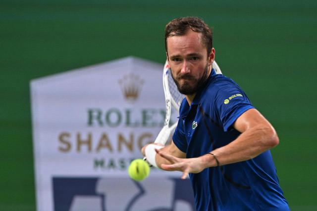 Russia's Daniil Medvedev hits a return to Rafael Jodar during their men's singles semi-final match at the Shanghai Masters tennis tournament in Shanghai on October 17, 2026. (Photo by Hector RETAMAL / AFP)