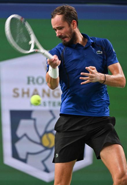 Russia's Daniil Medvedev hits a return to Rafael Jodar during their men's singles semi-final match at the Shanghai Masters tennis tournament in Shanghai on October 17, 2026. (Photo by Hector RETAMAL / AFP)