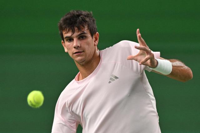 Spain's Rafael Jodar hits a return to Russia's Daniil Medvedev during their men's singles semi-final match at the Shanghai Masters tennis tournament in Shanghai on October 17, 2026. (Photo by Hector RETAMAL / AFP)