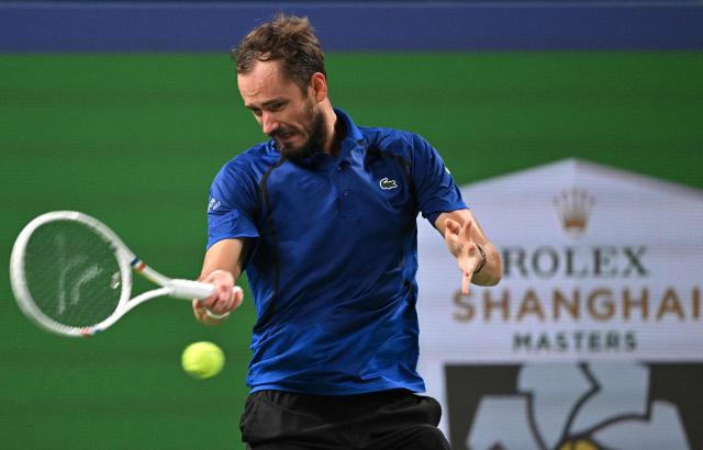 Russia's Daniil Medvedev hits a return to Rafael Jodar during their men's singles semi-final match at the Shanghai Masters tennis tournament in Shanghai on October 17, 2026. (Photo by Hector RETAMAL / AFP)