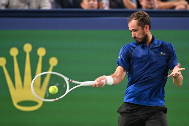 Russia's Daniil Medvedev hits a return to Rafael Jodar during their men's singles semi-final match at the Shanghai Masters tennis tournament in Shanghai on October 17, 2026. (Photo by Hector RETAMAL / AFP)