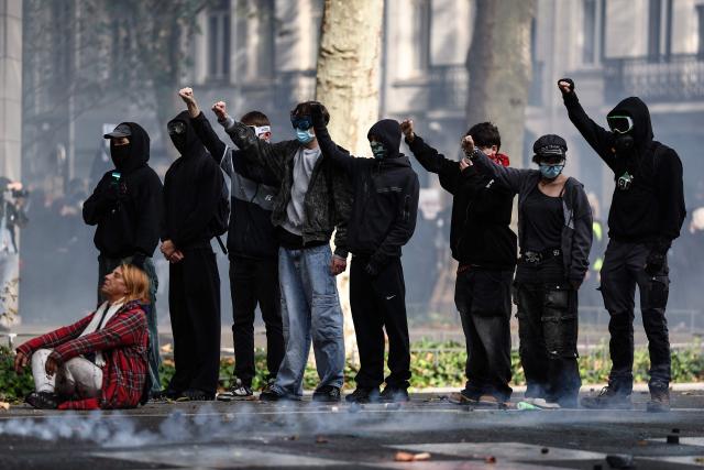 Protesters chant slogans and gestures as they attend a demonstration to protest against the "high cost of living", in Lille, northern France, on October 17, 2026 as part of a nationwide call for mobilisation bringing together various groups expressing their anger: former "Yellow Vests", secondary school and university students, climate activists and even farmers. After weeks of student protests, France faces broader, nationwide demonstrations on October 17, 2026 over the cost of living, setting up a potentially fraught six months heading into a presidential election. A police source told AFP that authorities estimated nearly 200,000 people could take part, with 40,000 in Paris. (Photo by Sameer AL-DOUMY / AFP)