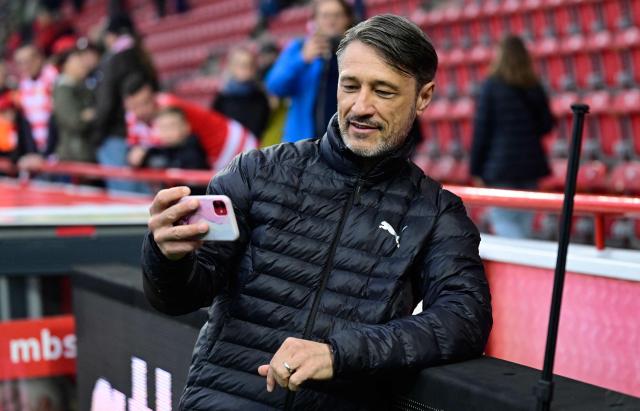 Dortmund's Croatian head coach Niko Kovac takes a selfie with a fan (unseen, in the background) prior to the German first division Bundesliga football match between Union berlin and Borussia Dortmund in Berlin on October 17, 2026. (Photo by John MACDOUGALL / AFP) / DFL REGULATIONS PROHIBIT ANY USE OF PHOTOGRAPHS AS IMAGE SEQUENCES AND/OR QUASI-VIDEO