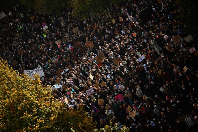 Protesters march on Boulevard Voltaire during a demonstration against the "high cost of living", in Paris on October 17, 2026 as part of a nationwide call for mobilisation bringing together various groups expressing their anger: former "Yellow Vests", secondary school and university students, climate activists and even farmers. After weeks of student protests, France faces broader, nationwide demonstrations on October 17, 2026 over the cost of living, setting up a potentially fraught six months heading into a presidential election. A police source told AFP that authorities estimated nearly 200,000 people could take part, with 40,000 in Paris. (Photo by Guillaume Saligot / AFP)