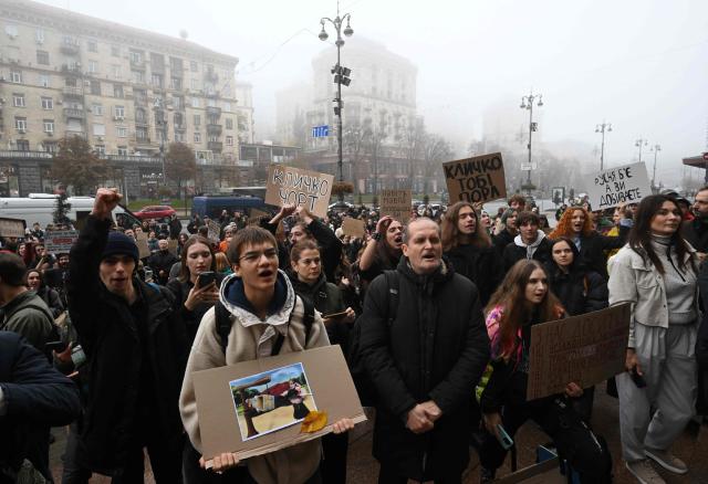 Activists hold placards and chant “Down with Klitschko” during a rally outside the town hall in Kyiv on October 17, 2026, calling for the resignation of Kyiv Mayor Vitali Klitschko, amid the Russian invasion of Ukraine. Representatives of various Ukraine public organisations declare systemic problems in Kyiv's administration over the last 12 years of Klitschko's tenure and the capital's lack of readiness for winter amid mass Russia shelling. (Photo by Sergei SUPINSKY / AFP)
