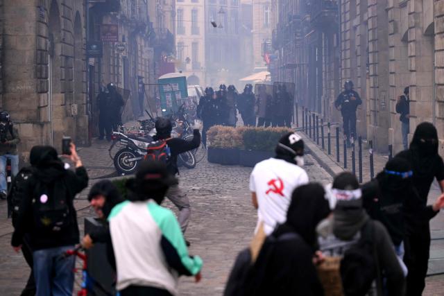 A projectile is launched by security personal in the direction of the protesters during a demonstration to protest against the "high cost of living", in Bordeaux, southwestern France, on October 17, 2026 as part of a nationwide call for mobilisation bringing together various groups expressing their anger: former "Yellow Vests", secondary school and university students, climate activists and even farmers. After weeks of student protests, France faces broader, nationwide demonstrations on October 17, 2026 over the cost of living, setting up a potentially fraught six months heading into a presidential election. A police source told AFP that authorities estimated nearly 200,000 people could take part, with 40,000 in Paris. (Photo by Christophe ARCHAMBAULT / AFP)