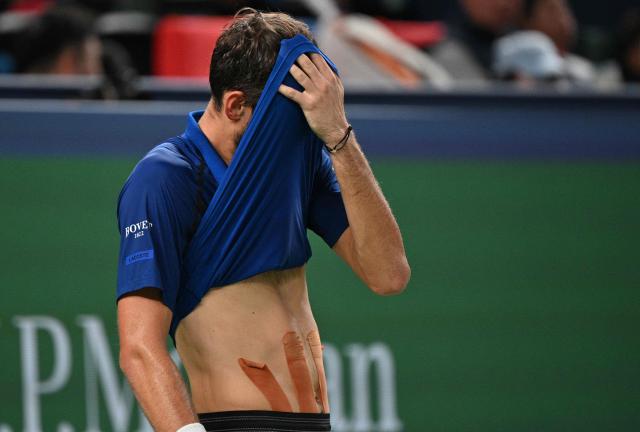 Russia's Daniil Medvedev wipes his face between points against Rafael Jodar during their men's singles semi-final match at the Shanghai Masters tennis tournament in Shanghai on October 17, 2026. (Photo by Hector RETAMAL / AFP)