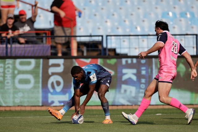 Bulls' South African wing Cheswill Jooste scores a try during the European Rugby Champions Cup group A match between the Bulls and Stade Francais at the Loftus Versfeld Stadium in Pretoria on October 17, 2026. (Photo by PHILL MAGAKOE / AFP)
