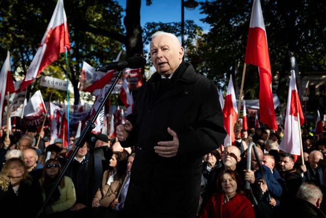 Jaroslaw Kaczynski, Poland's former Prime Minister and leader of the Law and Justice (Prawo i Sprawiedliwosc, PiS) right-wing opposition party, speaks during an anti-government demonstration in front of the Constitutional Court in Warsaw on October 17, 2026. Right wing demonstrators hold a camp protest outside the building of the Constitutional Court in Poland in protest against the nomination of new judges and in defence of those appointed by the previous government of the Law and Justice Party (PiS). (Photo by Wojtek RADWANSKI / AFP)