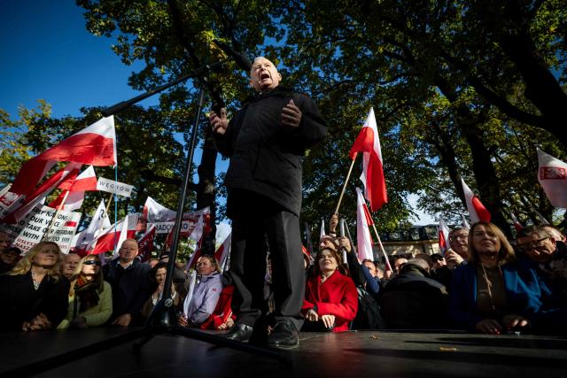 Jaroslaw Kaczynski, Poland's former Prime Minister and leader of the Law and Justice (Prawo i Sprawiedliwosc, PiS) right-wing opposition party, speaks during an anti-government demonstration in front of the Constitutional Court in Warsaw on October 17, 2026. Right wing demonstrators hold a camp protest outside the building of the Constitutional Court in Poland in protest against the nomination of new judges and in defence of those appointed by the previous government of the Law and Justice Party (PiS). (Photo by Wojtek RADWANSKI / AFP)