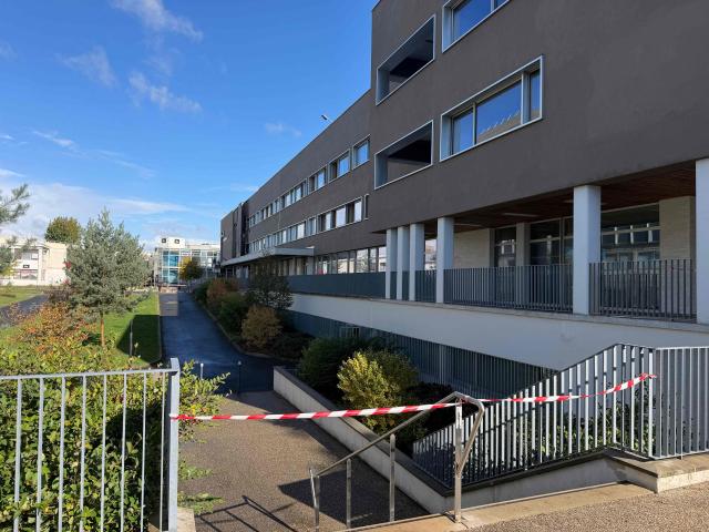 This general view shows the entrance to the Faculty of Arts 'Michel Serres' building of the University of Rouen at Mont-Saint-Aignan on the outskirts of Rouen, north-western France on October 17, 2026, following a suspected act of arson at the establishment. A criminal investigation has started into the fire that severely damaged a building of the Faculty of Arts in Rouen, in Mont-Saint-Aignan (Seine-Maritime), early October 17. According to the initial findings, the fire started from a pile of rubbish or a garbage bin in front of the entrance to the building, according to a source close to the case and the public prosecutor of Rouen, Sébastien Gallois. (Photo by Manuel SANSON / AFP)