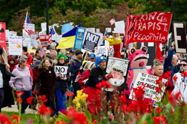 Demonstrators march during a "No Kings: Vote Early" rally near Memorial Circle in Arlington, Virginia, on October 17, 2026. The national day of action is taking place in cities across the country focusing on voter turnout, early voting and election protection, ahead of the midterm elections. (Photo by Amid FARAHI / AFP)