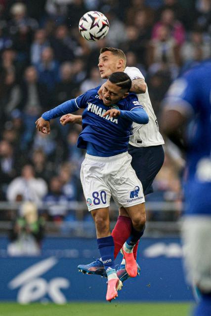 Strasbourg's Moroccan midfielder #80 Gessime Yassine (L) and Paris Saint-Germain's French defender #12 Lucas Digne jump to head the ball during the French L1 football match between RC Strasbourg Alsace and Paris Saint-Germain (PSG) at the Stade de la Meinau in Strasbourg, eastern France, on October 17, 2026. (Photo by ROMEO BOETZLE / AFP)