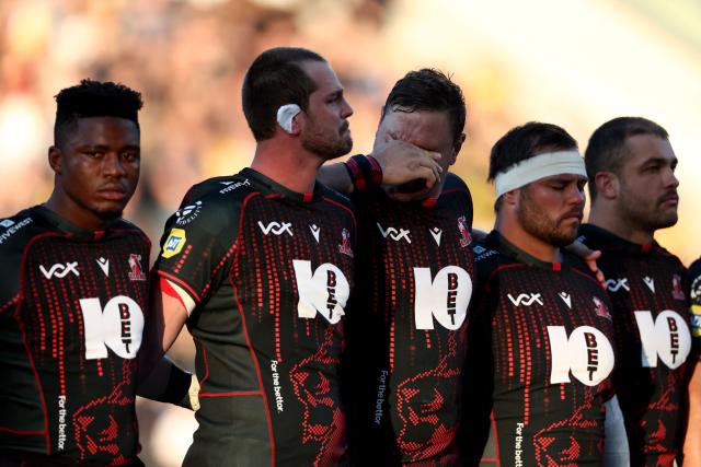 Lions players observe a moment of silence in honour of their teammate Hyron Andrews, ahead of the European Rugby Champions Cup rugby union match between Stade Rochelais (La Rochelle) and Lions at at the Marcel-Deflandre Stadium in La Rochelle, western France, on October 17, 2026. South African second row Hyron Andrews of Johannesburg-based side the Lions was found dead at a hotel in France on October 16, on the eve of his team's Champions Cup match against La Rochelle, local authorities told AFP. (Photo by ROMAIN PERROCHEAU / AFP)