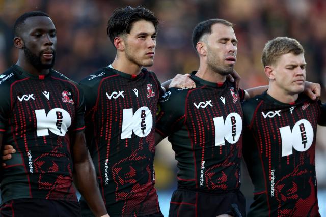 South Africa's Morne Van Den Berg (R) and other Lions players observe a moment of silence in honour of their teammate Hyron Andrews, ahead of the European Rugby Champions Cup rugby union match between Stade Rochelais (La Rochelle) and Lions at at the Marcel-Deflandre Stadium in La Rochelle, western France, on October 17, 2026. South African second row Hyron Andrews of Johannesburg-based side the Lions was found dead at a hotel in France on October 16, on the eve of his team's Champions Cup match against La Rochelle, local authorities told AFP. (Photo by ROMAIN PERROCHEAU / AFP)