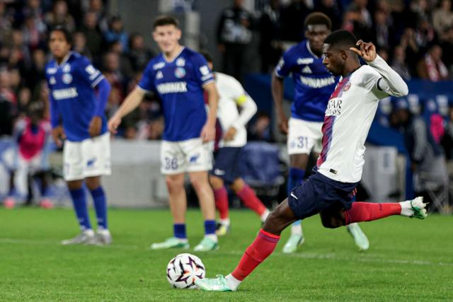 Paris Saint-Germain's French forward #10 Ousmane Dembele kicks a penalty during the French L1 football match between RC Strasbourg Alsace and Paris Saint-Germain (PSG) at the Stade de la Meinau in Strasbourg, eastern France, on October 17, 2026. (Photo by ROMEO BOETZLE / AFP)