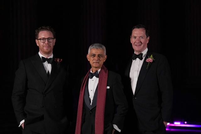 (L-R) Director of the British Museum Nicholas Cullinan, Mayor of London Sadiq Khan and former Chancellor of the Exchequer George Osborne pose on the red carpet upon arrival to attend The British Museum Ball 2026 in London on October 17, 2026. (Photo by CARLOS JASSO / AFP)