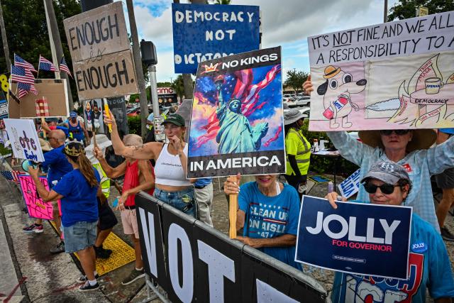 People take part in a "No Kings: Vote Early" demonstration in Wilton Manors, Florida, on October 17, 2026. The national day of action is taking place in cities across the country focusing on voter turnout, early voting and election protection, ahead of the midterm elections. (Photo by Giorgio VIERA / AFP)