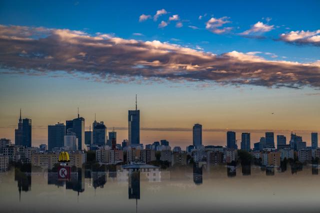 This photograph taken on October 17, 2026 shows Warsaw's skyline from the rooftop of the Forest Campus office building during the annual Night of Skyscrapers, when the city's tallest buildings open their rooftops to the public. (Photo by Sergei GAPON / AFP)