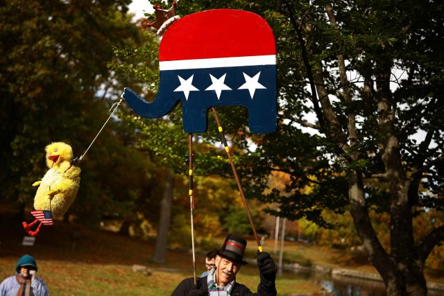 People take part in a "No Kings: Vote Early" demonstration in Portland, Maine on October 17, 2026. The national day of action is taking place in cities across the country focusing on voter turnout, early voting and election protection, ahead of the midterm elections. (Photo by CHARLY TRIBALLEAU / AFP)
