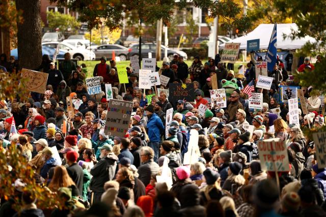 People take part in a "No Kings: Vote Early" demonstration in Portland, Maine on October 17, 2026. The national day of action is taking place in cities across the country focusing on voter turnout, early voting and election protection, ahead of the midterm elections. (Photo by CHARLY TRIBALLEAU / AFP)