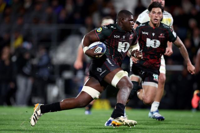 Lions' South African flanker Batho Hlekani runs with the ball during the European Rugby Champions Cup rugby union match between Stade Rochelais (La Rochelle) and Lions at at the Marcel-Deflandre Stadium in La Rochelle, western France, on October 17, 2026. (Photo by ROMAIN PERROCHEAU / AFP)