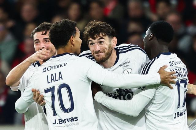 Brest's French defender #04 Gautier Lloris (2R) celebrates with his teammates after his team scored their first goal during the French L1 football match between Lille LOSC and Stade Brestois 29 (Brest) at the Stade Pierre-Mauroy in Villeneuve-d'Ascq, northern France, on October 17, 2026. (Photo by Sameer AL-DOUMY / AFP)