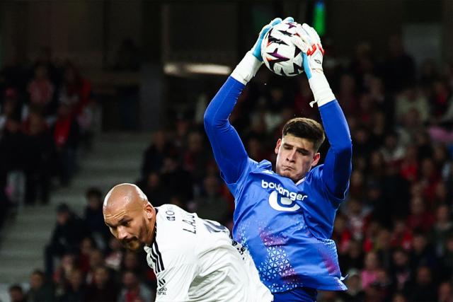 Lille's Paraguayan goalkeeper #12 Orlando Gill grabs the ball next to Brest's French forward #19 Ludovic Ajorque (L) during the French L1 football match between Lille LOSC and Stade Brestois 29 (Brest) at the Stade Pierre-Mauroy in Villeneuve-d'Ascq, northern France, on October 17, 2026. (Photo by Sameer AL-DOUMY / AFP)