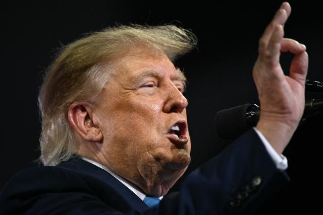 US President Donald Trump speaks at a midterm campaign rally at Truist Arena in Highland Heights, Kentucky on October 17, 2026. (Photo by Brendan SMIALOWSKI / AFP)