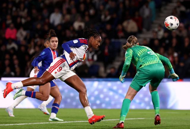 Lyon's French forward #09 Marie-Antoinette Katoto (L) scores her team second goal during the French Women L1 football match between Paris Saint-Germain (PSG) and OL Lyonnes (OL) at the Parc des Princes stadium in Paris on October 17, 2026. (Photo by FRANCK FIFE / AFP)