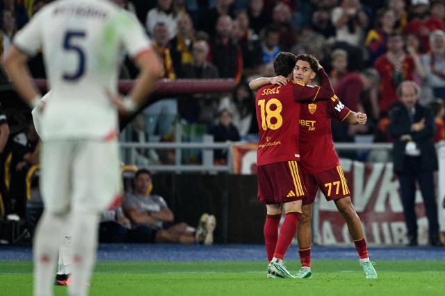 AS Roma's Italian defender #77 Emanuele Lulli (R) celebrates with a teammate after scoring a goal during the Italian Serie A football match between AS Roma and Genoa at the Olympic Stadium in Rome on October 17, 2026. (Photo by Andreas SOLARO / AFP)