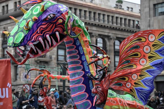 An alebrije sculpture is displayed during the Alebrijes Parade ahead of Day of the Dead celebrations in Mexico City on October 17, 2026. The Alebrijes Parade is an annual event celebrating Mexican folk art and handicrafts, during which giant mythical creatures made of "cartoneria" (a form of papier-mache) are paraded from Mexico City's Zocalo through the capital's main avenues to the Angel of Independence, where they remain on display. (Photo by Alfredo ESTRELLA / AFP)