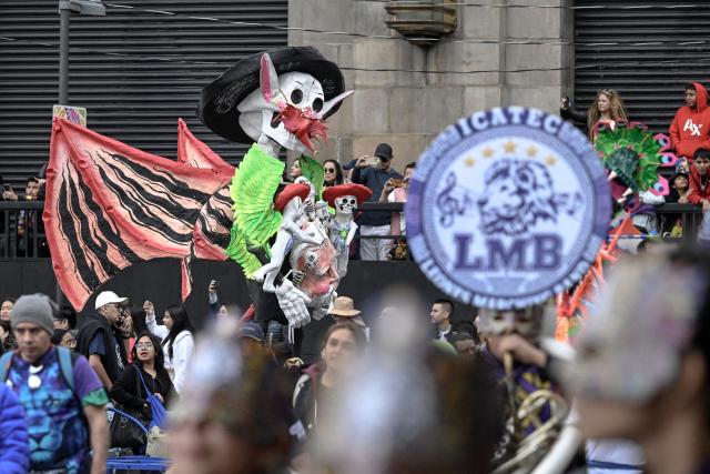 An alebrije sculpture is displayed during the Alebrijes Parade ahead of Day of the Dead celebrations in Mexico City on October 17, 2026. The Alebrijes Parade is an annual event celebrating Mexican folk art and handicrafts, during which giant mythical creatures made of "cartoneria" (a form of papier-mache) are paraded from Mexico City's Zocalo through the capital's main avenues to the Angel of Independence, where they remain on display. (Photo by Alfredo ESTRELLA / AFP)