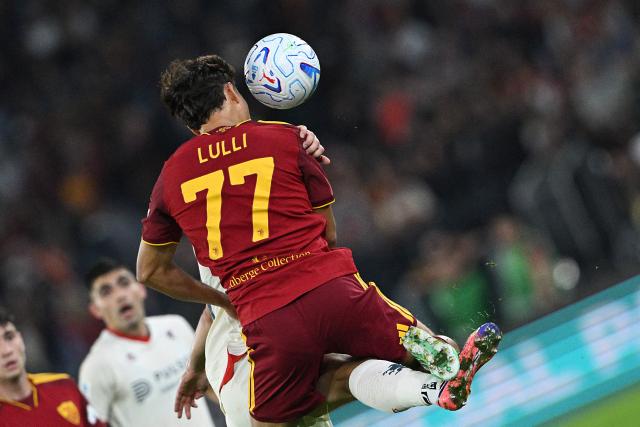 AS Roma's Italian defender #77 Emanuele Lulli jumps for the ball during the Italian Serie A football match between AS Roma and Genoa at the Olympic Stadium in Rome on October 17, 2026. (Photo by Andreas SOLARO / AFP)