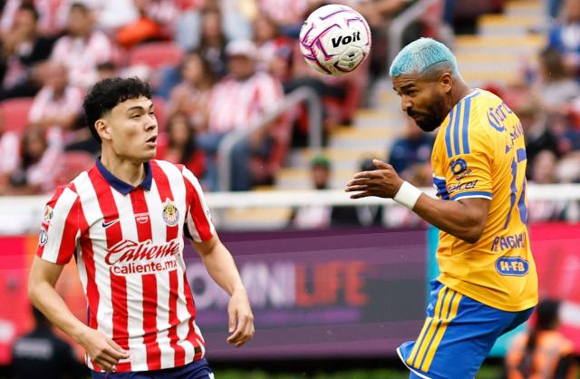 Guadalajara's defender #16 Luis Gabriel Rey and Tigres’ Uruguayan forward #17 Rodrigo Aguirre fight for the ball during the Liga MX Apertura tournament football match between Guadalajara and Tigres at Akron stadium in Zapopan, Jalisco state, Mexico on October 17, 2026. (Photo by ULISES RUIZ / AFP)