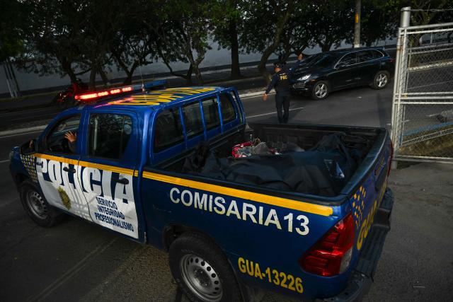 A Police pickup transports the body of lawyer Juan Francisco Solorzano Foppa at the Campo Marte sports complex in Guatemala City on October 17, 2026. Former Guatemalan prosecutor who denounced corruption cases and alleged links between gangs and politicians was shot dead in Guatemala City on October 17, 2026, police said. (Photo by Johan ORDONEZ / AFP)
