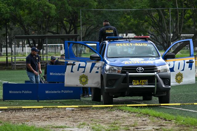 Forensic workers load the body of lawyer Juan Francisco Solorzano Foppa into a police pickup at the Campo Marte sports complex in Guatemala City on October 17, 2026. Former Guatemalan prosecutor who denounced corruption cases and alleged links between gangs and politicians was shot dead in Guatemala City on October 17, 2026, police said. (Photo by Johan ORDONEZ / AFP)
