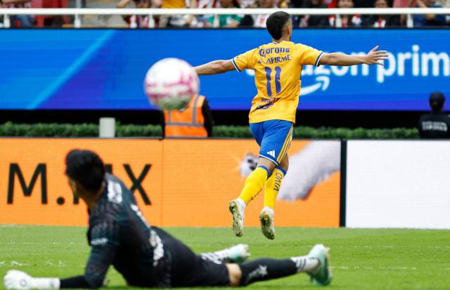Tigres' Argentine midfielder #11 Juan Brunetta celebrates after scoring the opening goal during the Liga MX Apertura tournament football match between Guadalajara and Tigres at Akron stadium in Zapopan, Jalisco state, Mexico on October 17, 2026. (Photo by ULISES RUIZ / AFP)