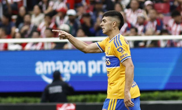 Tigres' Argentine midfielder #11 Juan Brunetta celebrates after scoring the opening goal during the Liga MX Apertura tournament football match between Guadalajara and Tigres at Akron stadium in Zapopan, Jalisco state, Mexico on October 17, 2026. (Photo by ULISES RUIZ / AFP)