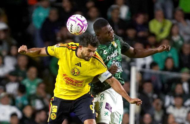 America's forward #09 Henry Martin and Leon's Colombian defender #14 Jhohan Romana fight for the ball during the Liga MX Apertura tournament football match between Leon and America at Leon stadium in Leon, Guanajuato state, Mexico on October 17, 2026. (Photo by Mario ARMAS / AFP)