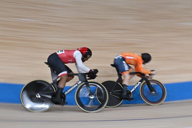 Trinidad and Tobago’s Nicholas Paul (L) and Netherlands’ Harrie Lavreysen compete in the men’s sprint semifinal at the 2026 UCI Track World Championships at the Shanghai Velodrome in Shanghai on October 18, 2026. (Photo by JADE GAO / AFP)