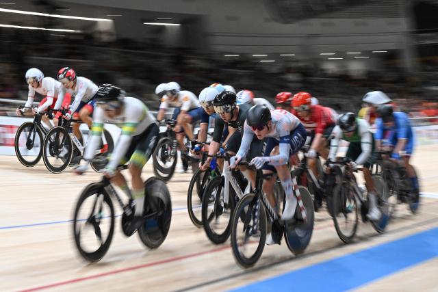 Athletes compete in the men’s elimination race at the 2026 UCI Track World Championships at the Shanghai Velodrome in Shanghai on October 18, 2026. (Photo by JADE GAO / AFP)