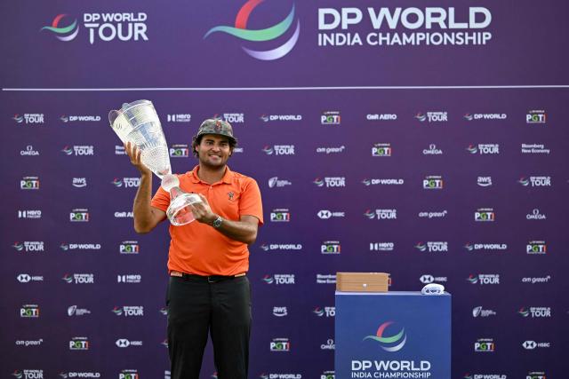 Spain's Eugenio Chacarra poses with the trophy after winning the DP World India Championship 2026 golf tournament at the Delhi Golf Club in New Delhi on October 18, 2026. (Photo by Arun SANKAR / AFP)