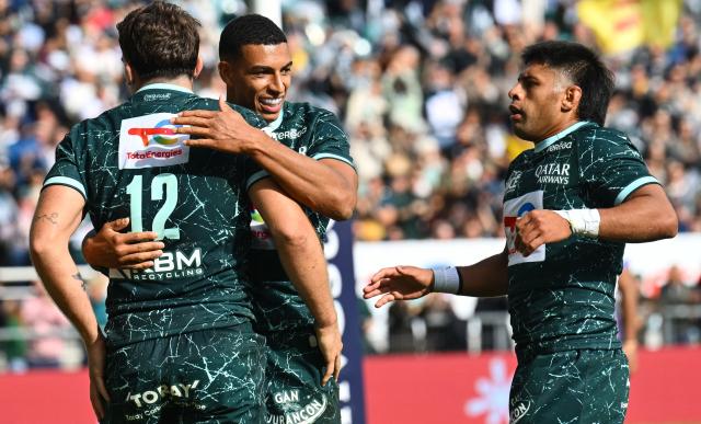 Pau's French centre Fabien Brau-Boirie (L), French wing Aaron Grandidier (C) and Argentinian scrum-half Gonzalo Garcia (R) celebrate after scoring  a try during the Pool Round 1 European Rugby Champions Cup rugby union match between Section Paloise and Leicester Tigers at Stade du Hameau in Pau, south-western France on October 18, 2026. (Photo by Gaizka IROZ / AFP)