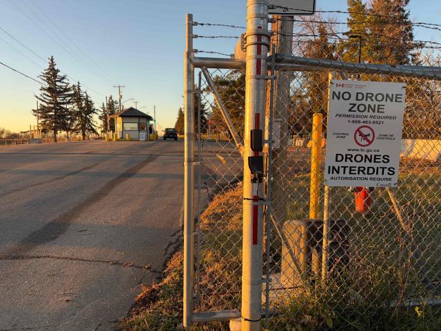 A view near the entrance of the Canadian Forces Base (CFB) Wainwright military base, in Wainwright, Alberta, Canada, on October 18, 2026. A "serious incident" at a military base in western Canada killed and injured multiple people and sparked a huge blaze on October 17, the government said. Canadian Prime Minister Mark Carney posted on X that "a serious incident creating a major fire" had occurred at Canadian Forces Base Wainwright military base in western Alberta province. (Photo by Daphné LEMELIN / AFP)