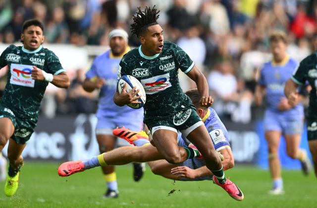 Pau's French fullback Theo Attissogbe is tackled during the Pool Round 1 European Rugby Champions Cup rugby union match between Section Paloise and Leicester Tigers at Stade du Hameau in Pau, south-western France on October 18, 2026. (Photo by Gaizka IROZ / AFP)