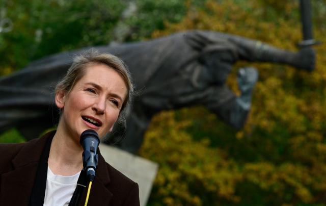 Co-leader of the Left party (Die Linke) Ines Schwerdtner addresses demonstrators at a Berlin memorial for German members of the International Brigades who fought for Republican Spain during the Spanish Civil War (1936-39), during a commemoration by various leftist organisations on the 90th anniversary of the start of the war, and the formation of the International Brigades, on October 18, 2026. Some 4,000 to 5,000 German volunteers, many of them anti-fascist exiles, communists, and working-class veterans of the Weimar Republic, fought in Spain. (Photo by John MACDOUGALL / AFP)
