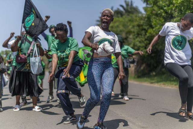 Supporters of the UmKhonto we Sizwe Party (MKP) sing and chant slogans during an election campaign mini rally in Umgababa, south of Durban on October 18, 2026, ahead of the country’s upcoming municipal elections. (Photo by RAJESH JANTILAL / AFP)
