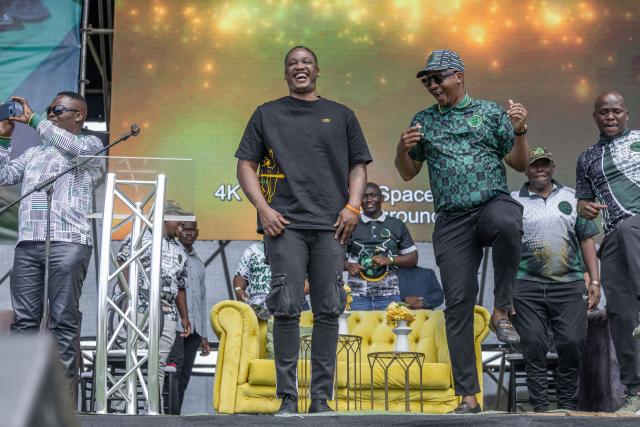 UmKhonto we Sizwe Party's (MKP) First President Duduzane Zuma (CL) gestures on stage during an election campaign mini rally in Umgababa, south of Durban on October 18, 2026, ahead of the country’s upcoming municipal elections. (Photo by RAJESH JANTILAL / AFP)